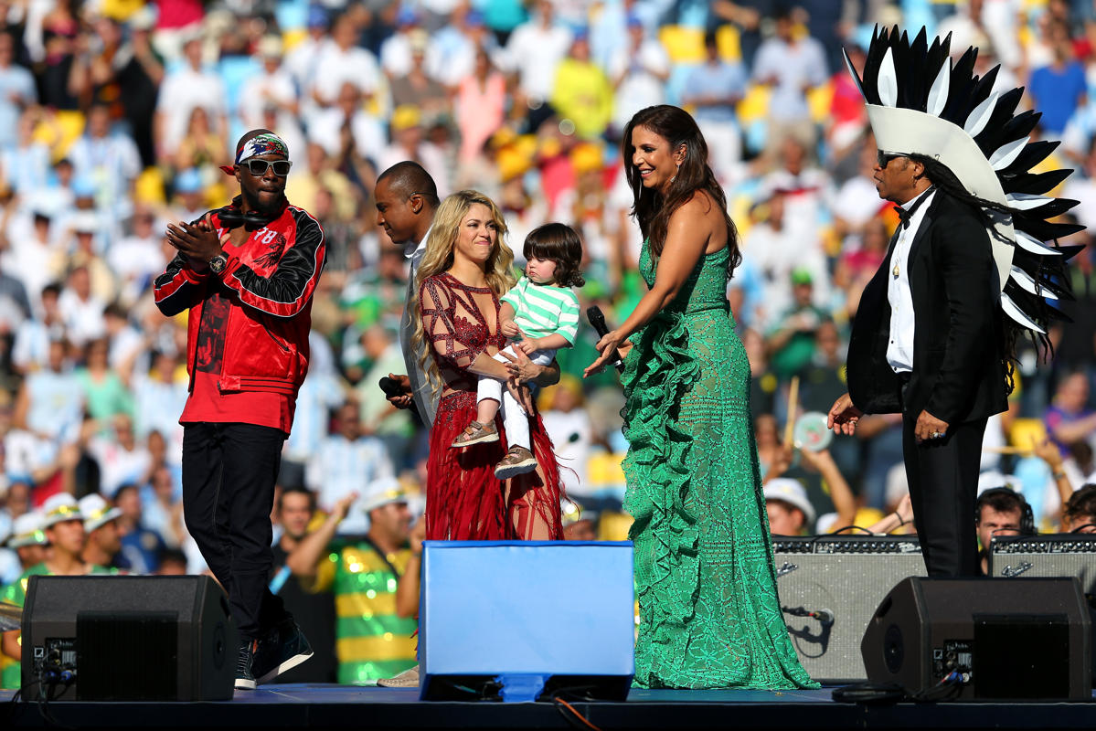 Soccer fans smile as they wait for the start of the group E World Cup soccer match between Switzerland and Ecuador at the Estadio Nacional in Brasilia, Brazil, Sunday, June 15, 2014